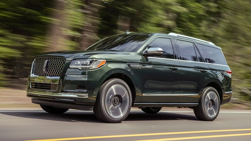 Gorgeous 2022 Lincoln Navigator riding down a forest road
